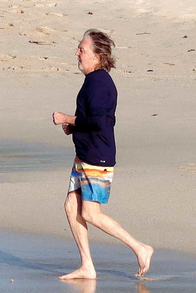Paul McCartney and Nancy Shevell show love on a beach vacation