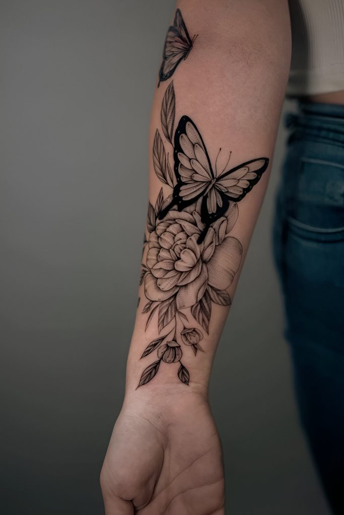 A butterfly and peony tattoo