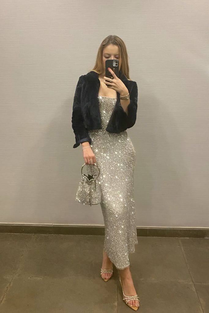 Shearling jacket over a sparkling mini dress