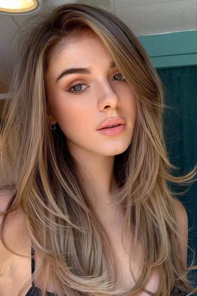 Deep side part on long straight hair