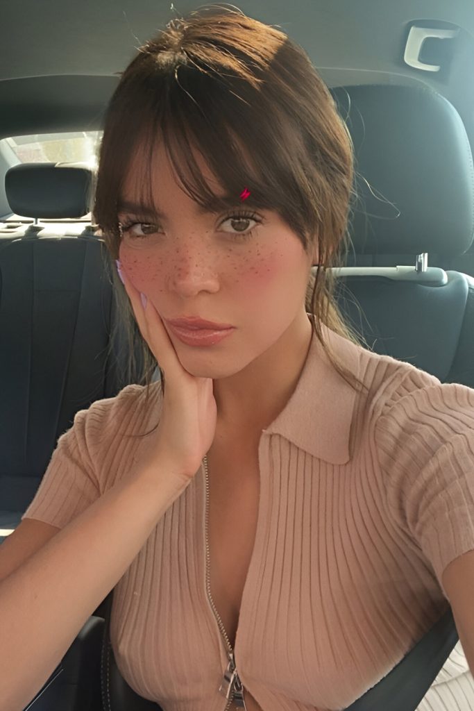 Slicked Back Curtain Bangs for a Minimalist Look