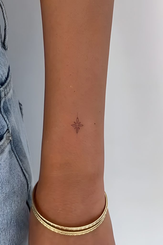 Dainty Gold Hoops with a Small Constellation Tattoo