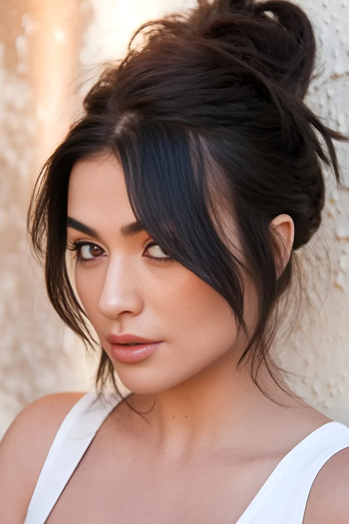 Glamorous Updo with Curtain Bangs for Special Occasions