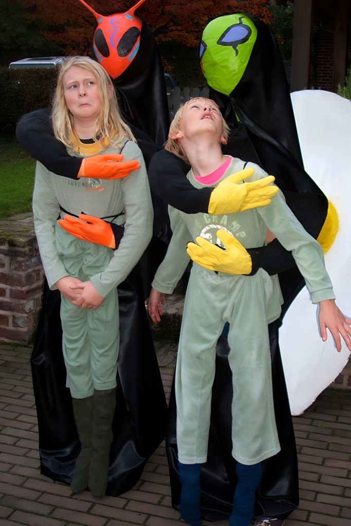 Interstellar Traders Haggling With Their Baby Alien Friend