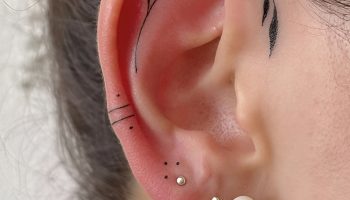 Layered Huggies with a Single Line Arrow Tattoo