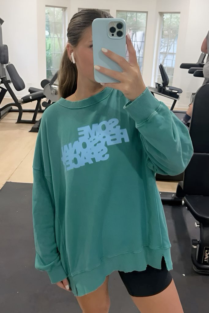 Graphic Sweatshirt over Performance Shorts and Tights