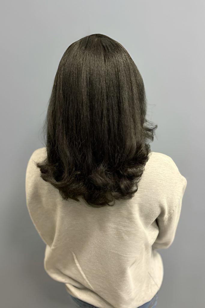 Silk Press with Soft Curls at the Ends for a Whimsical Touch