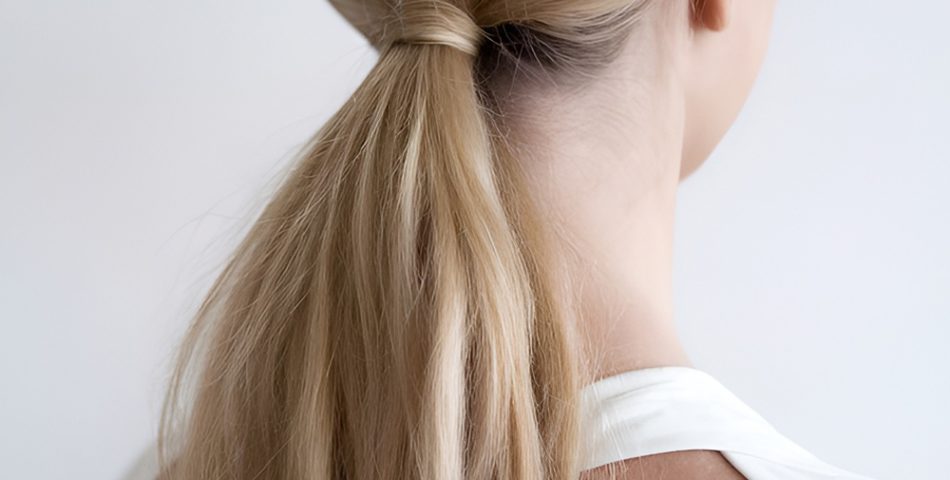 Sleek Low Ponytail with Middle Part
