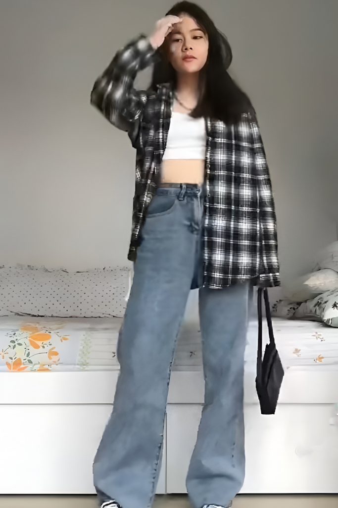 Easygoing Charm in an Open Flannel Shirt and Loose Jeans