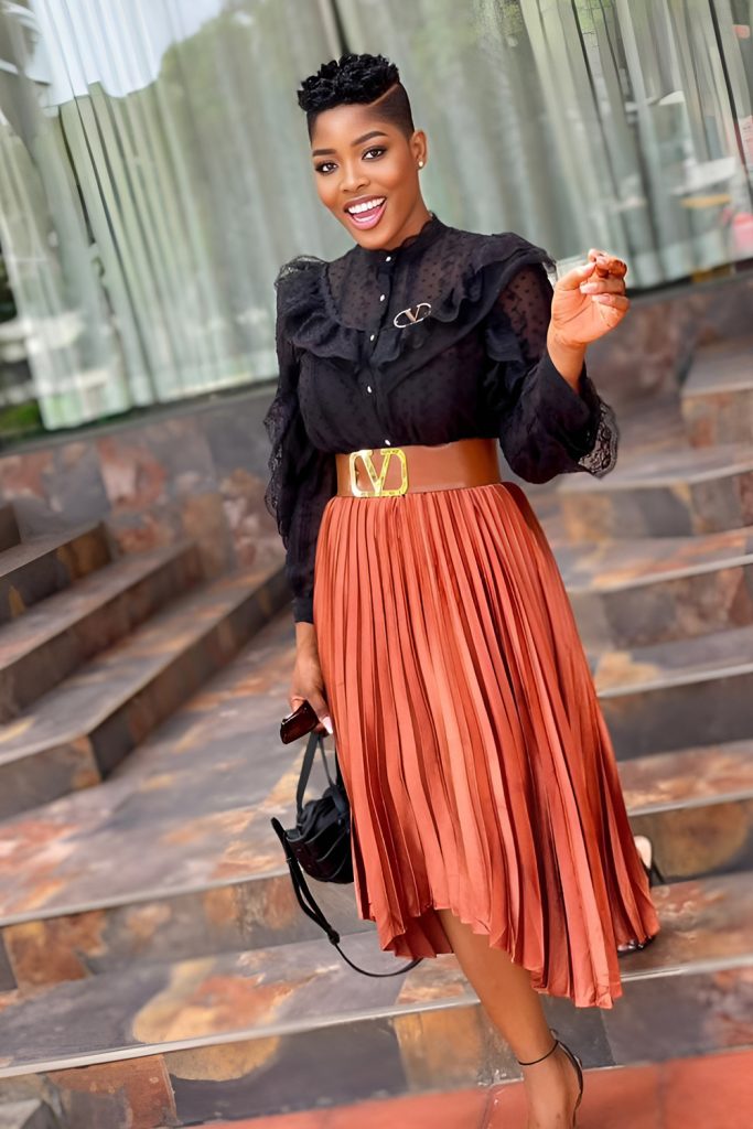 Flowing Pleated Midi Skirt with a Chic Turtleneck