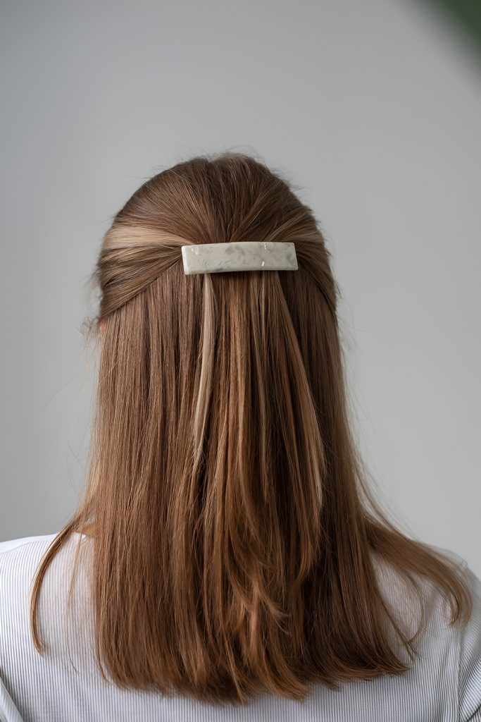 Sleek Straight Hair with Statement Barrette