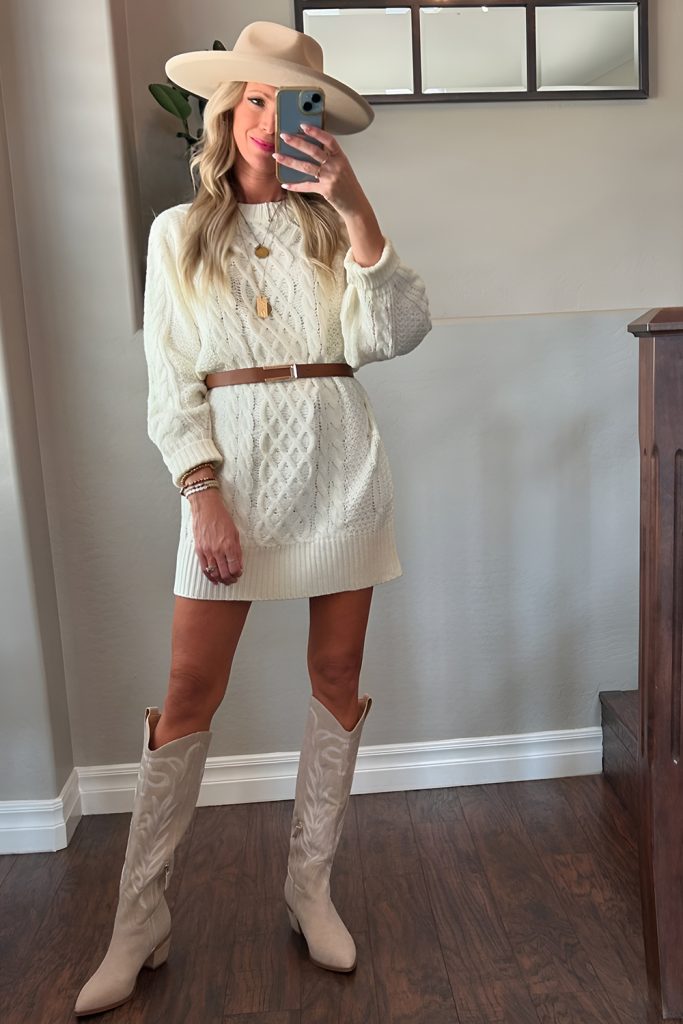 Stay warm and stylish in a sweater dress with western accessories