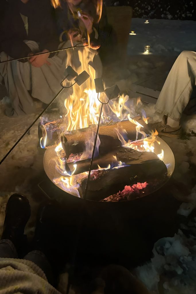 Outdoor bonfire gathering with hot drinks and a good atmosphere
