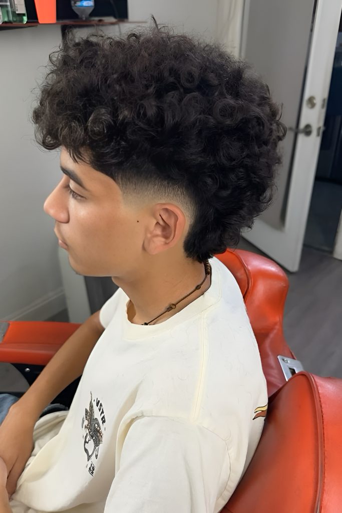 Sharp Fade Matched With a Curly Blowout Shape