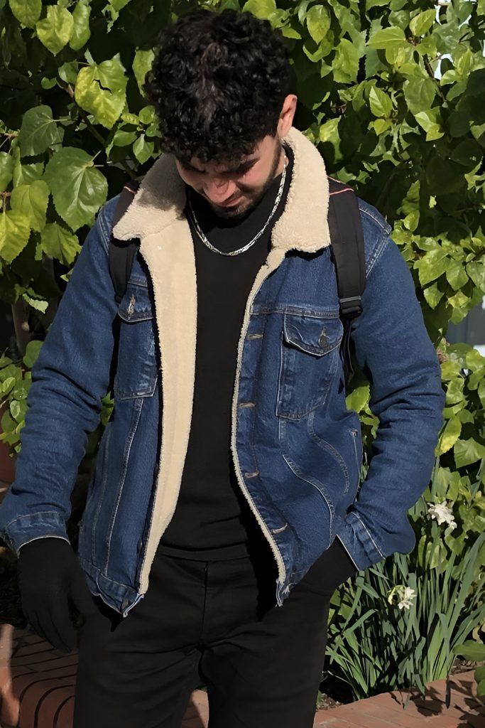 Sherpa Lined Denim Jacket Over a Knit Henley
