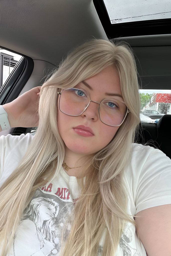 Curtain Bangs That Highlight the Eyes Behind Glasses