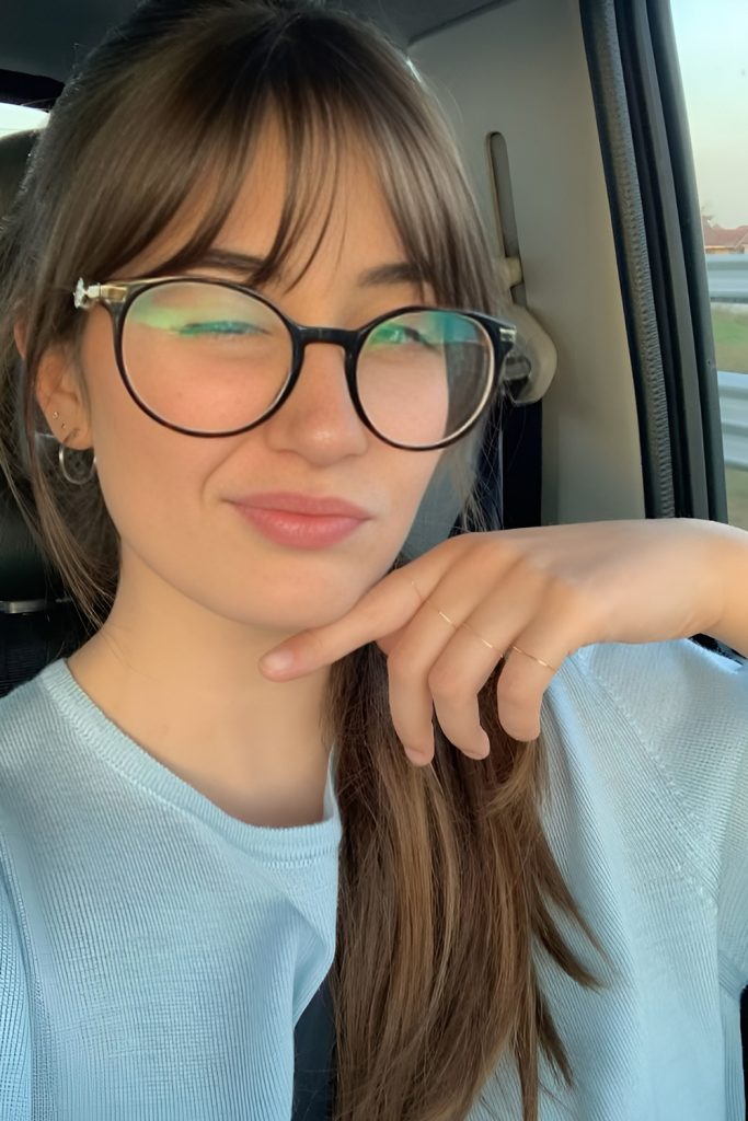 Curtain Bangs with Long Straight Hair and Bold Frames