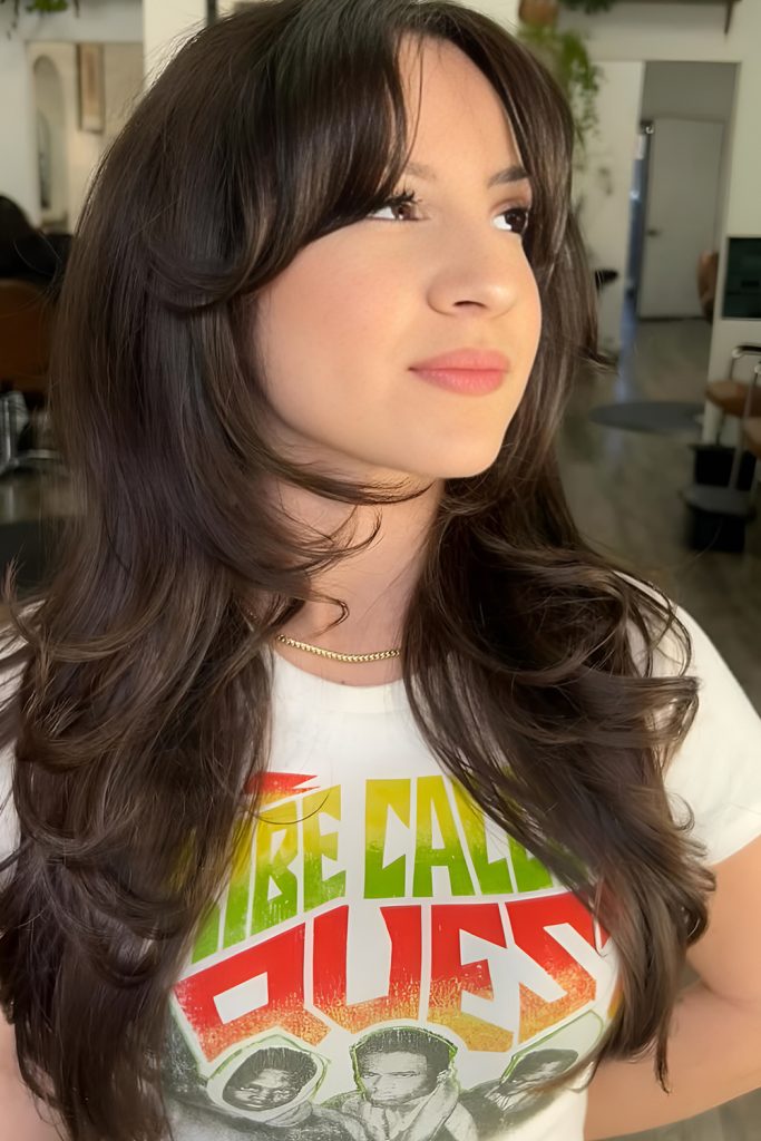 Long Hair with Curtain Bangs and Romantic Styling