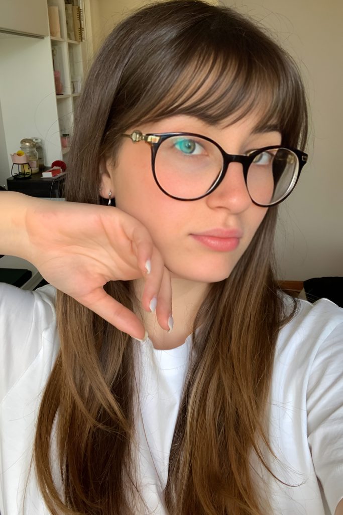 Long Layers with Curtain Bangs That Sit Perfectly Around Frames