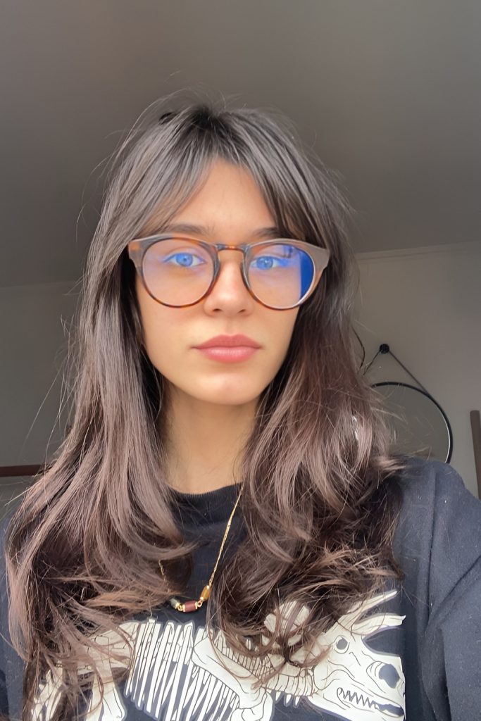 Long Straight Hair with Curtain Bangs and Minimal Styling