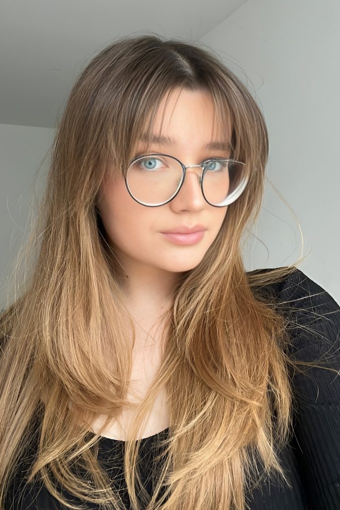 Long Straight Hair with Curtain Bangs and Round Glasses