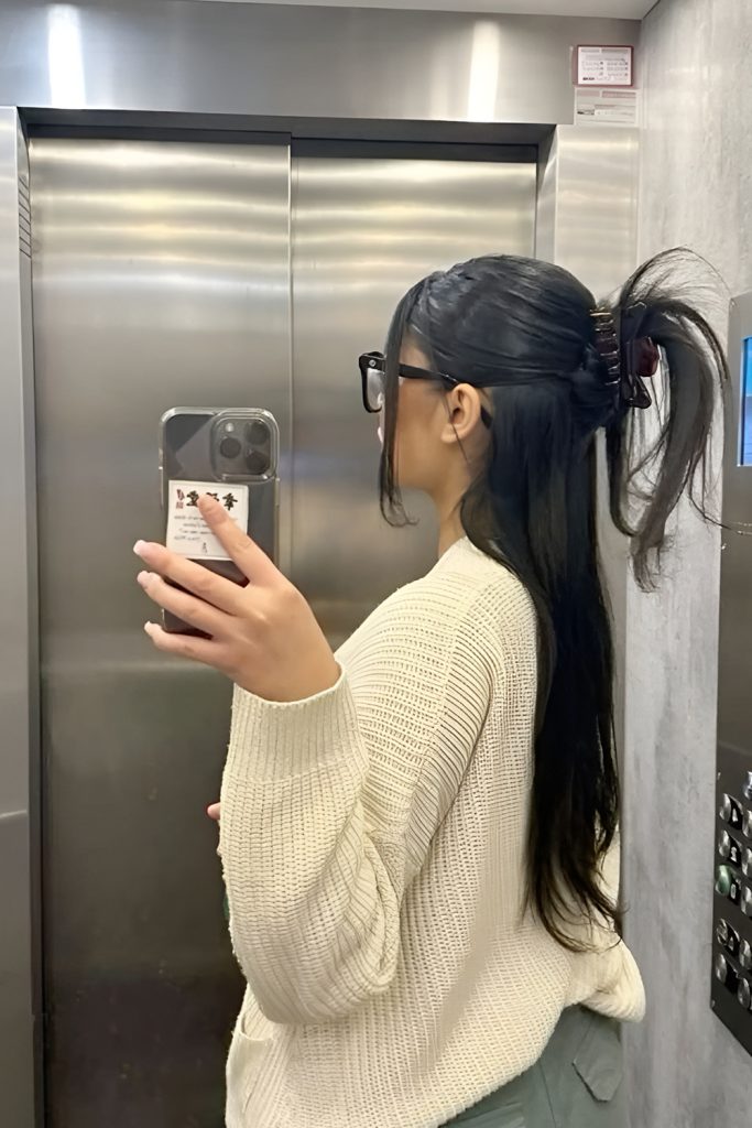 Claw Clip Updo with Loose Strands and Soft Texture
