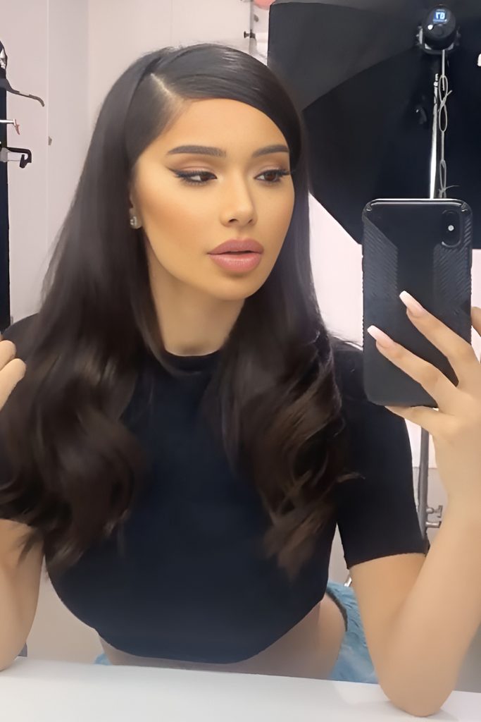 Long Wavy Hair with a Deep Side Part and Glam
