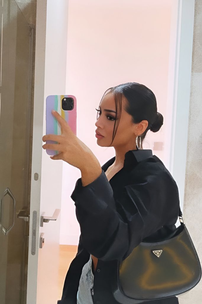 Low Slick Bun with Clean Parting and Polished Shine