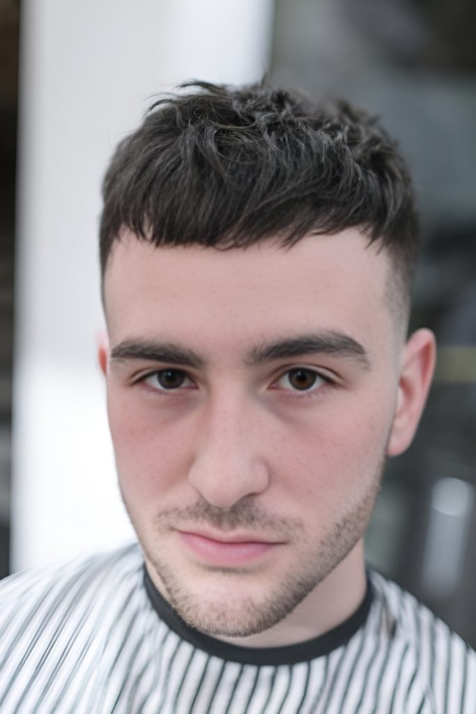 Bold Blunt Fringe Caesar Haircut with a Strong, Structured