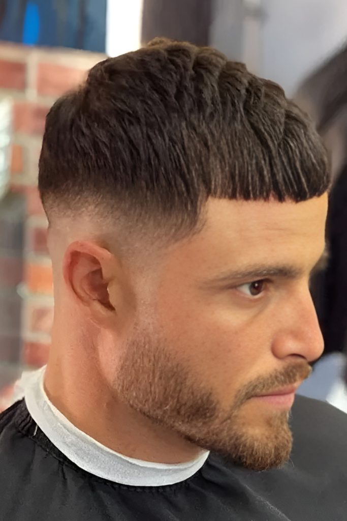 Caesar Haircut with a Subtle Line Design