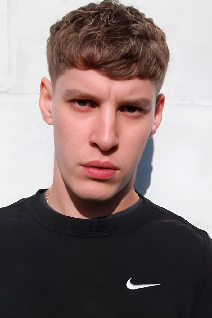 Modern Layered Caesar Haircut with Strong Texture