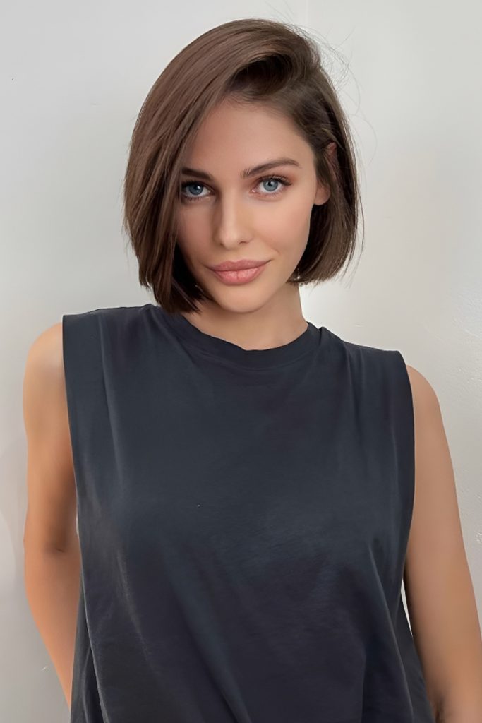 Short dark side-parted bob with a polished finish