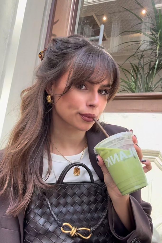 Half Up Hairstyle with Face Framing Curtain Bangs