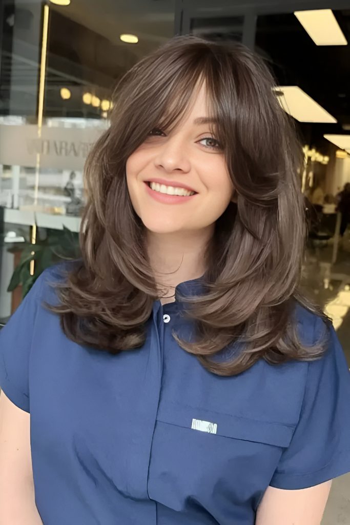 Layered Blowout with Voluminous Curtain Bangs