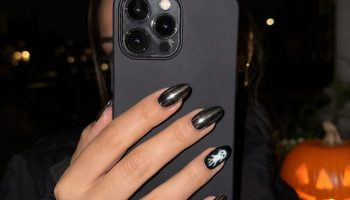 Halloween nails 2026, dark chrome nails with ghost accent design