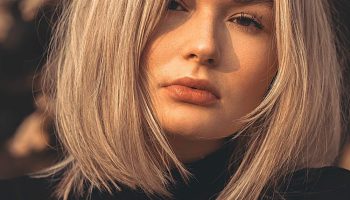 Woman with a textured choppy bob haircut in warm golden light