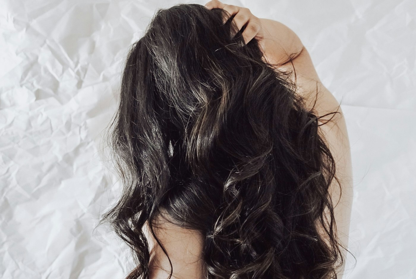 Back of a woman's head with long dark hair