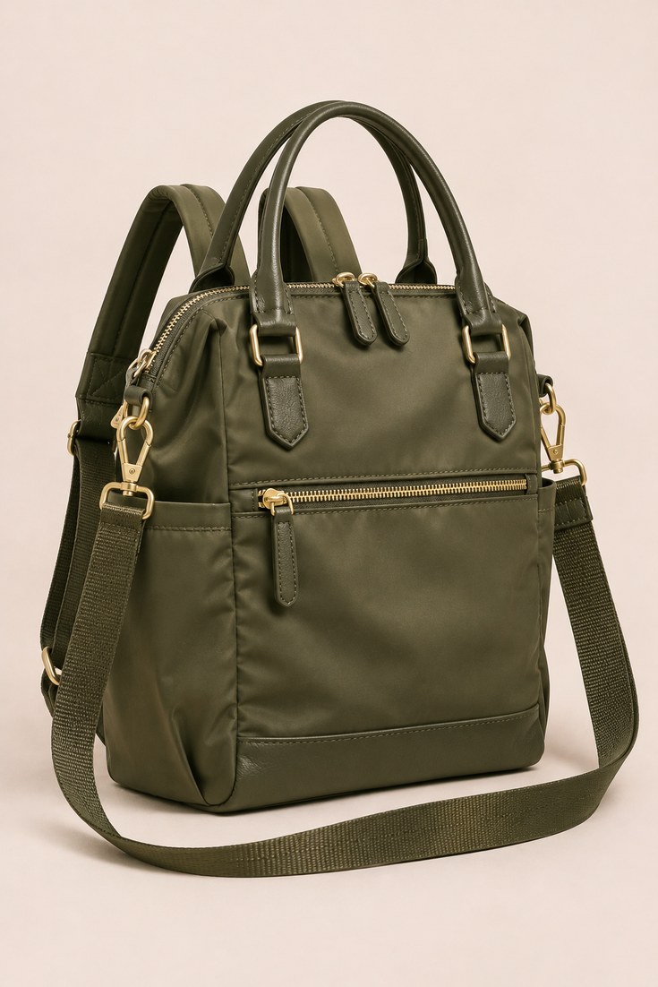 Olive green convertible bag shown with detachable shoulder strap and top handles on a soft ivory backdrop