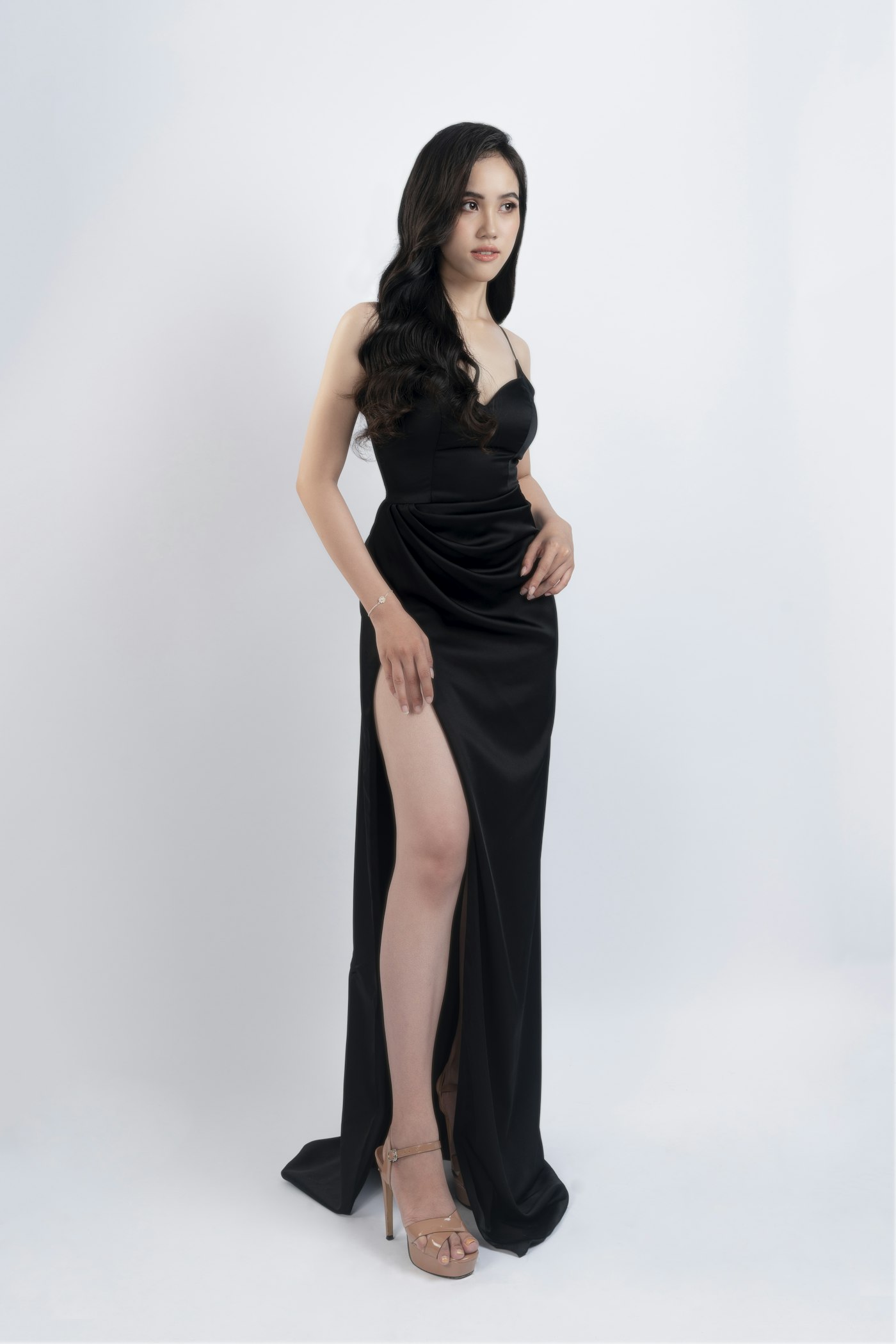 Woman in a black sleeveless dress