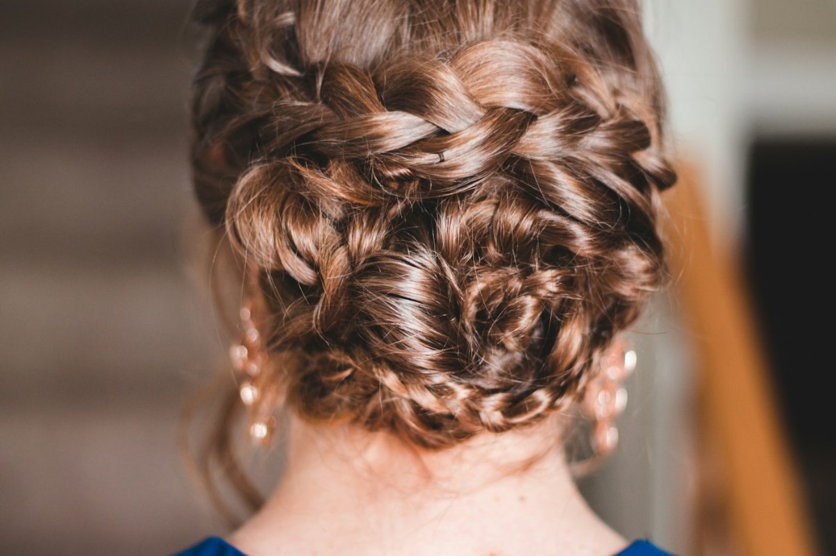 Woman with a neat braid framing her face