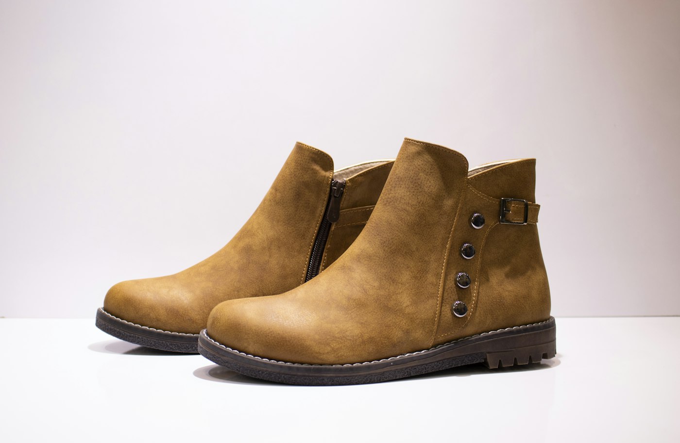 Close up of a pair of brown boots