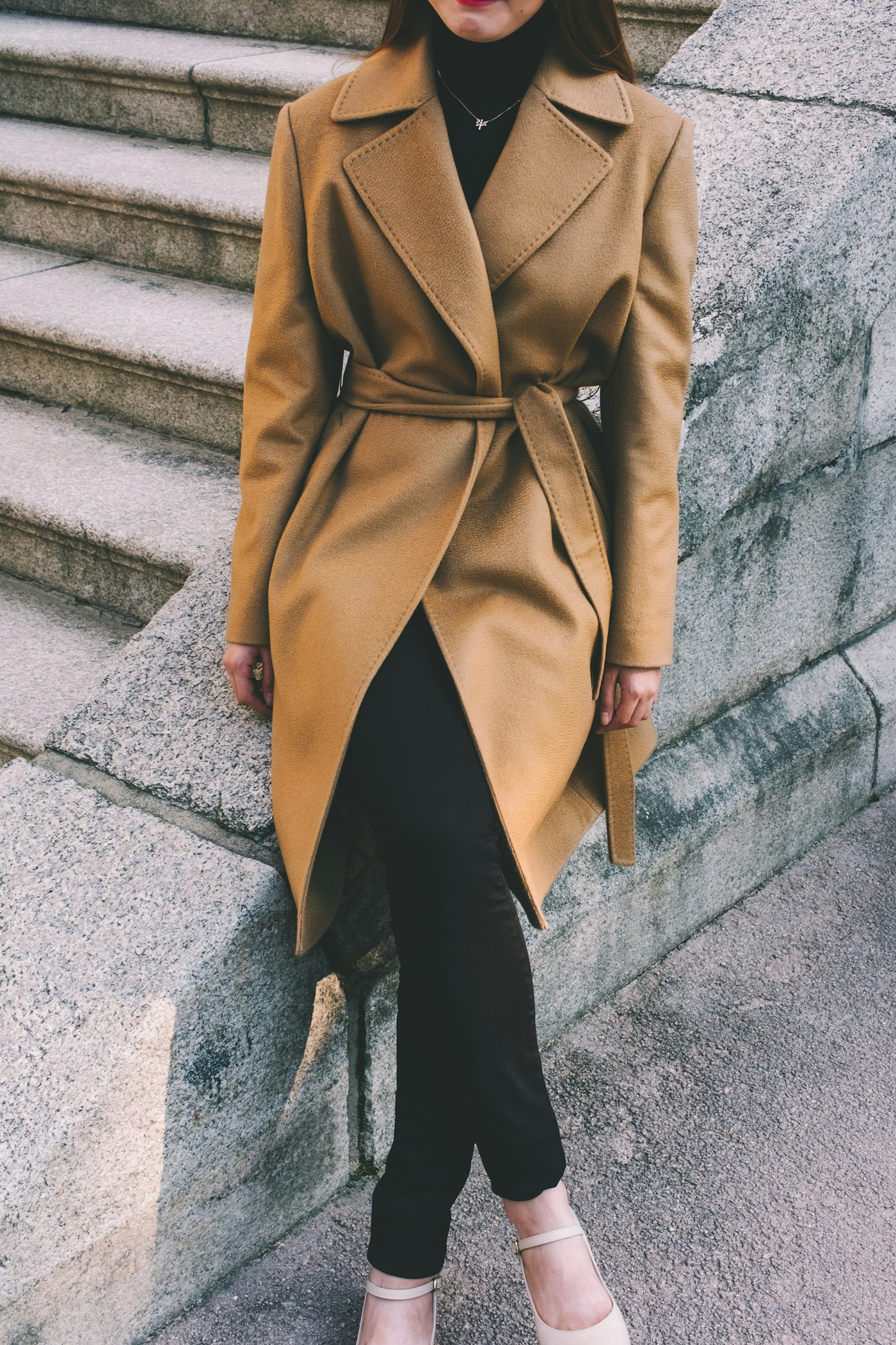 Woman wearing a brown notched lapel coat