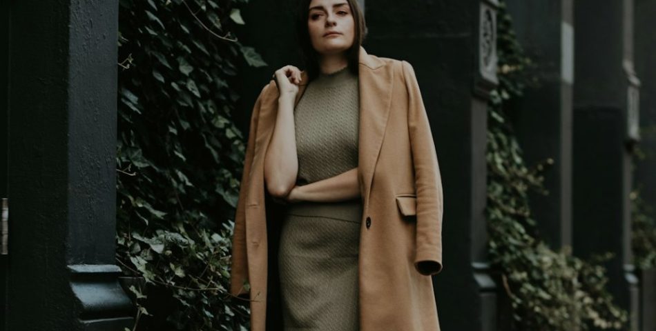 Neutral outfit graphic with a camel coat and olive skirt for a cropped jacket and trousers styling guide