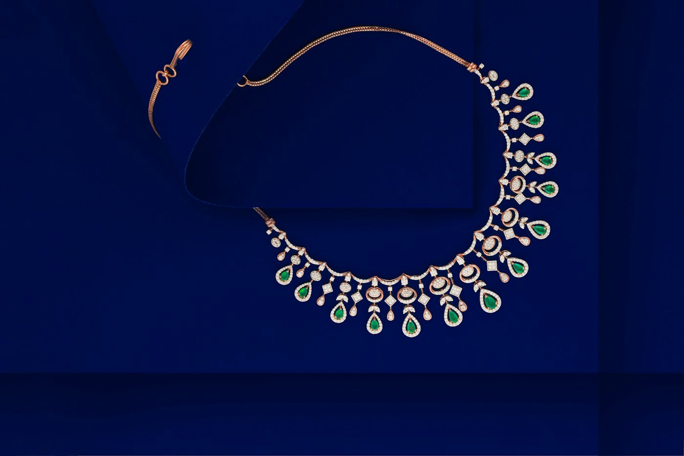 A diamond necklace and a pair of earrings on a surface