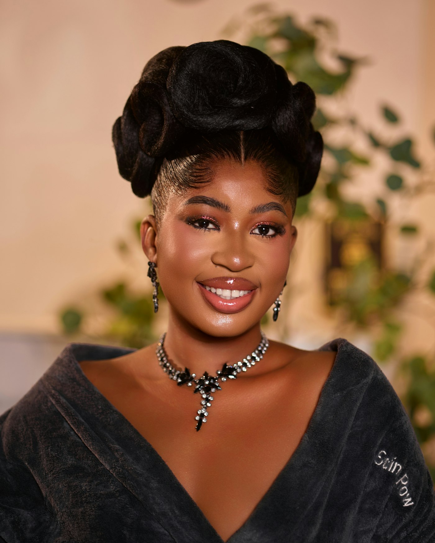 Young woman with an elaborate hairstyle and sparkling jewelry