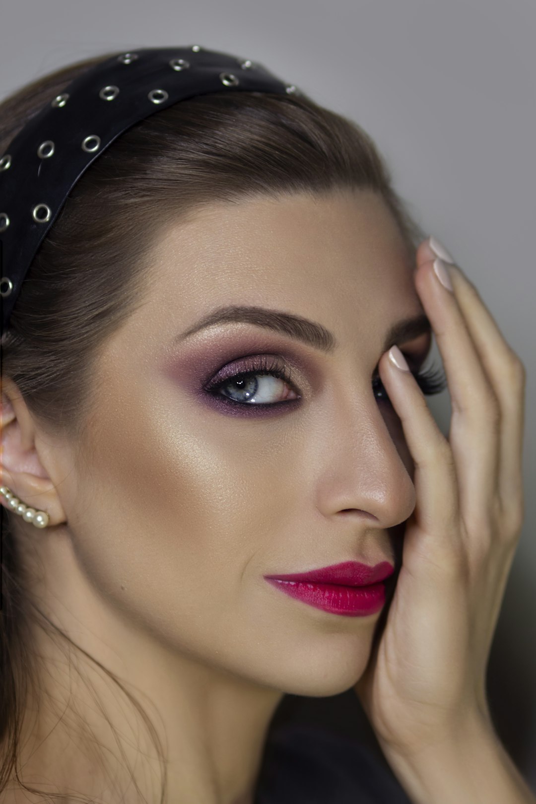 Woman wearing silver and diamond studded earrings