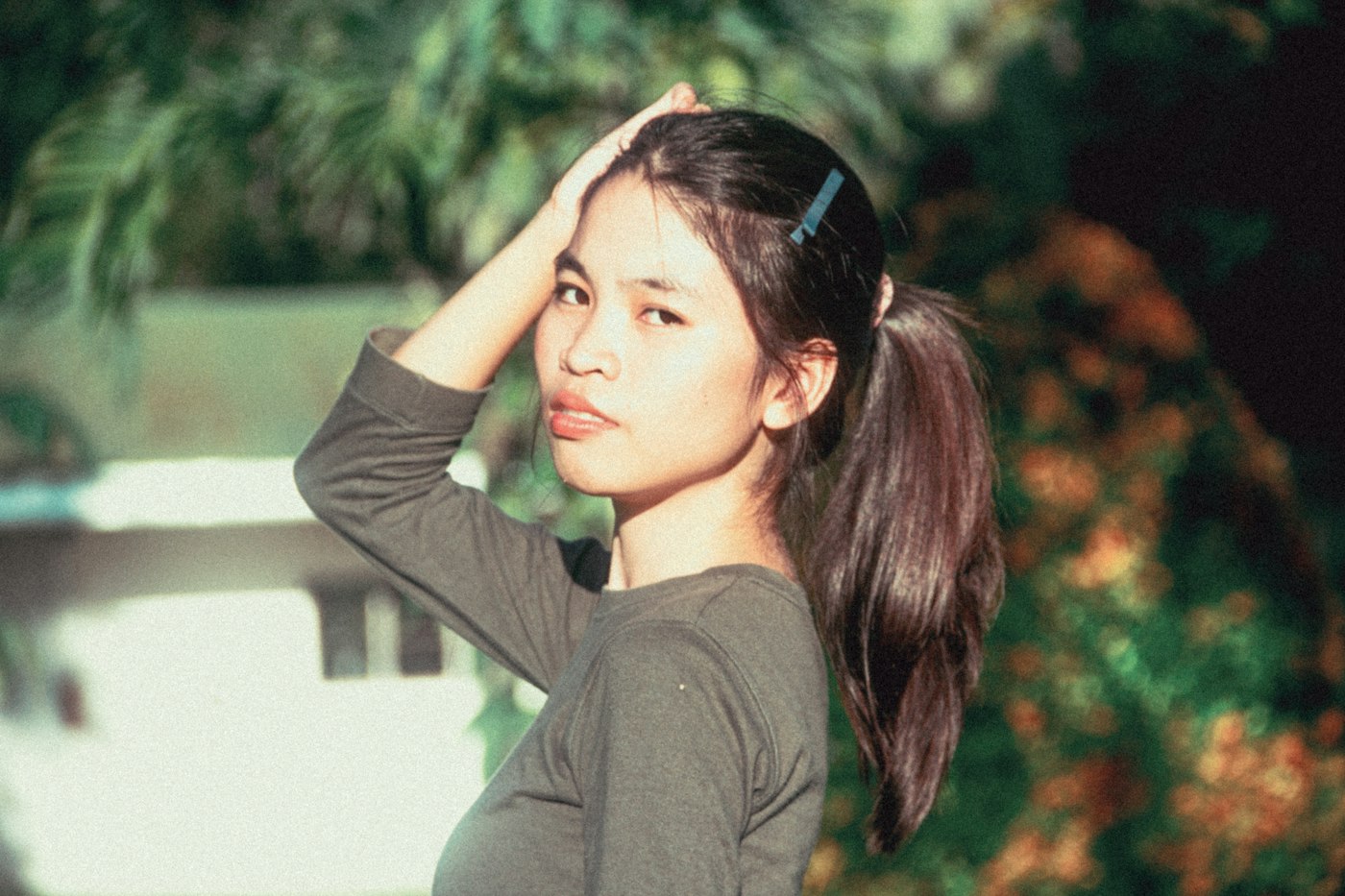 Woman holding her hair in a ponytail