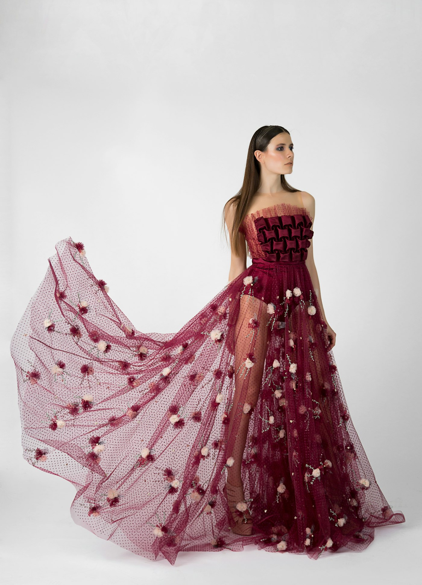 Woman in a maroon evening dress