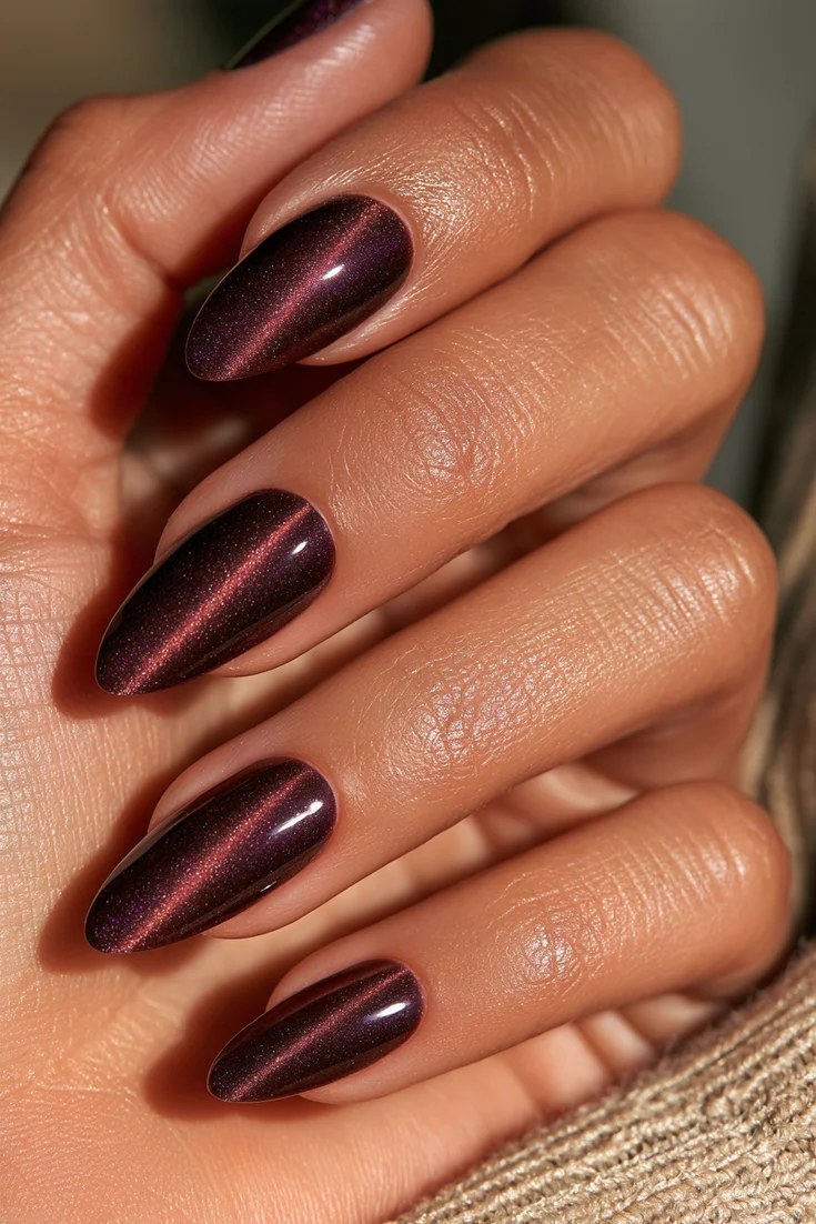Plum velvet nails in a deep berry shade, November nail idea