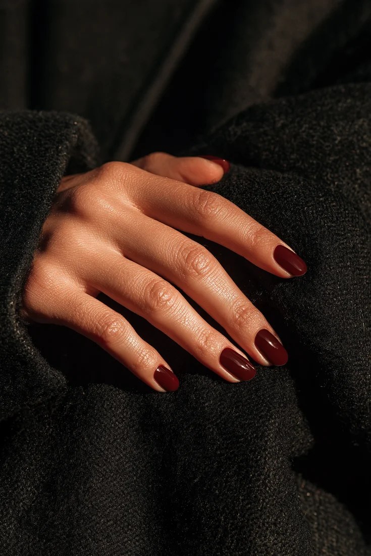 Oxblood almond nails in a dark burgundy red, November nail idea
